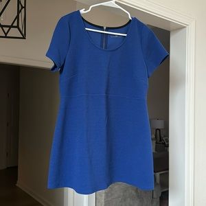 Motherhood maternity top with zipper detail on back.